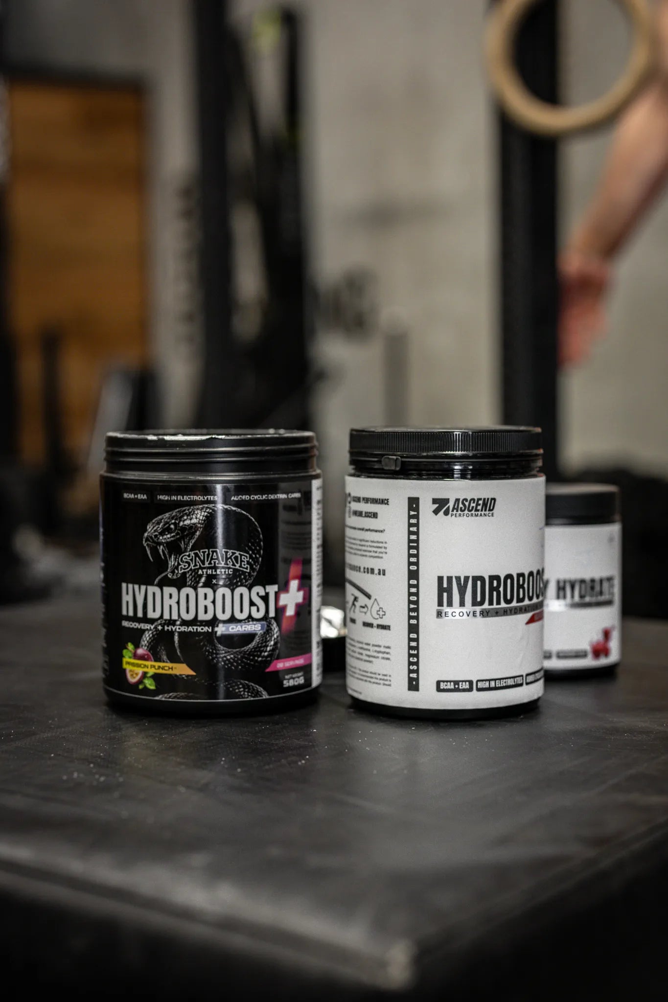 Hydroboost Carb+ and Hydroboost tubs on a gym floor